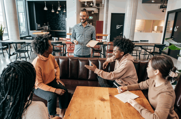 Group of people discussing around table