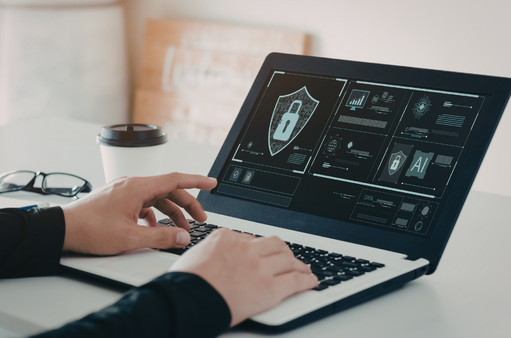 Typing on laptop with lock icon on screen