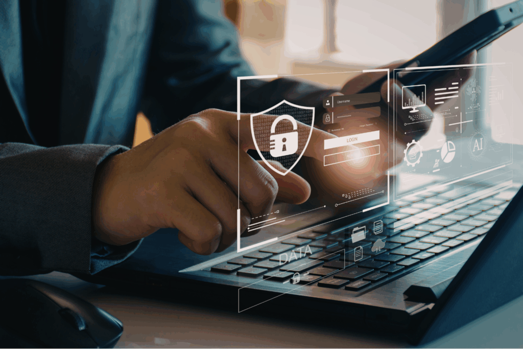 Man typing on laptop with digital lock icon